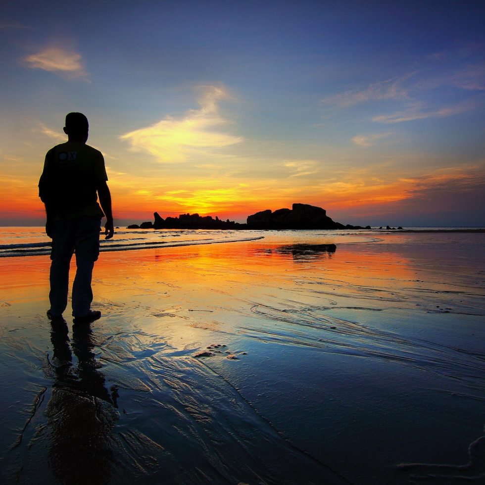 Vigil - lone man on a beach